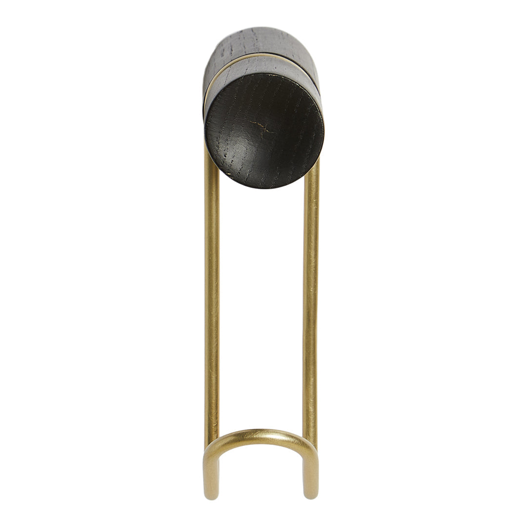 Modern black and gold candle holder with sleek cylindrical design and smooth metallic finish.