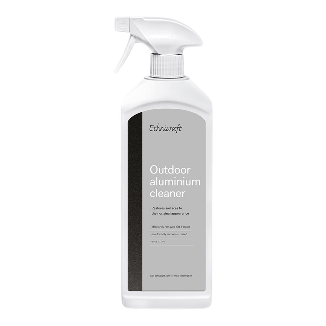 White spray bottle with a sleek gray label and black accents, showcasing a minimalist design.
