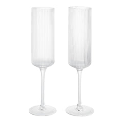 Clear ribbed glass champagne flutes with elegant tall stems, perfect for special occasions and celebrations.