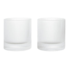 Clear glass tumblers with vertical ribbed texture, featuring a modern and elegant design. Perfect for any occasion.