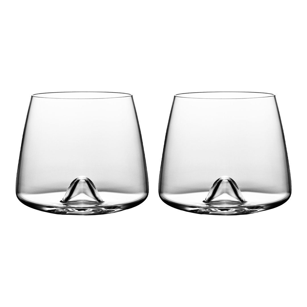 Set of two clear glass tumblers with a smooth, minimalist design and subtle curved base, showcasing a contemporary style.
