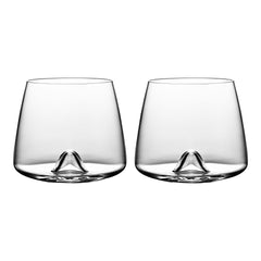 Set of two clear glass tumblers with a smooth, minimalist design and subtle curved base, showcasing a contemporary style.
