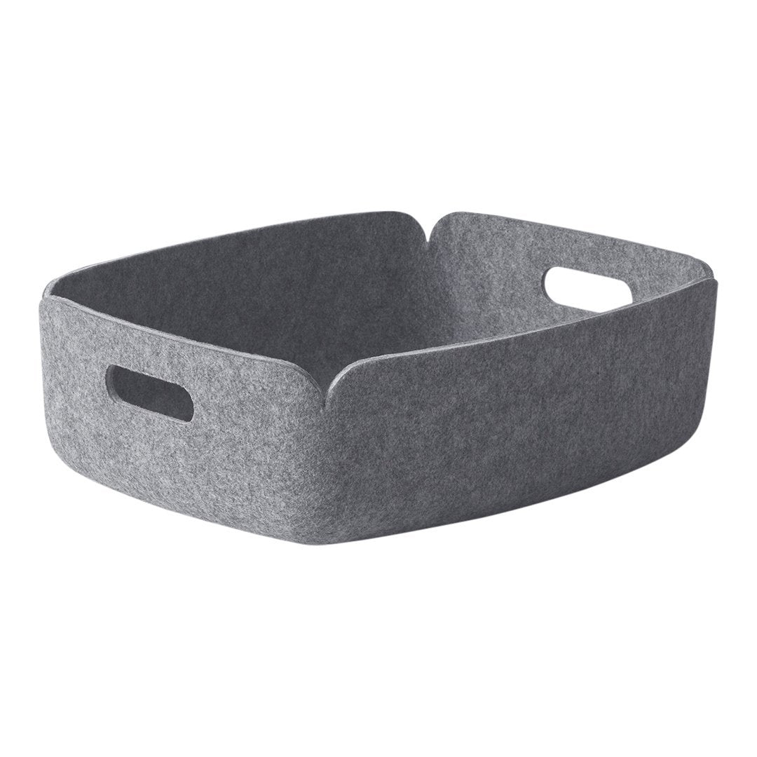 Gray felt storage basket with a minimalist design and subtle texture. Perfect for organizing any space.