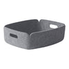 Gray felt storage basket with a minimalist design and subtle texture. Perfect for organizing any space.
