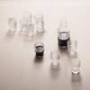 Clear glassware set with a sleek, modern design; featuring transparent and smoky grey patterns, ideal for elegant serving.