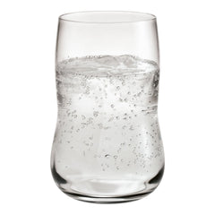 Clear glass tumbler filled with sparkling water, showcasing bubbles and a smooth, curved silhouette.