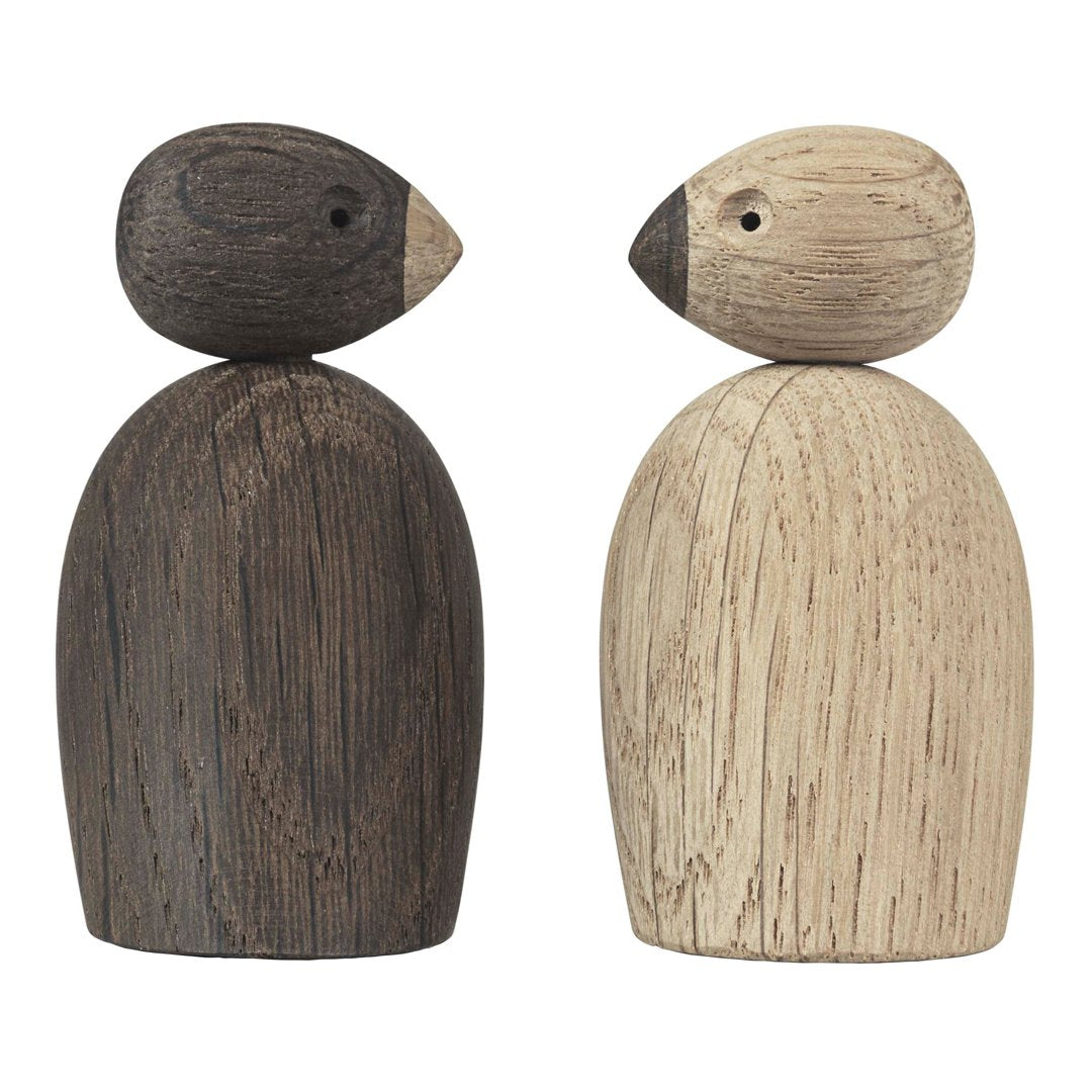 Wooden bird figurines featuring a dark brown and light beige color scheme with minimalist shapes and smooth textures.