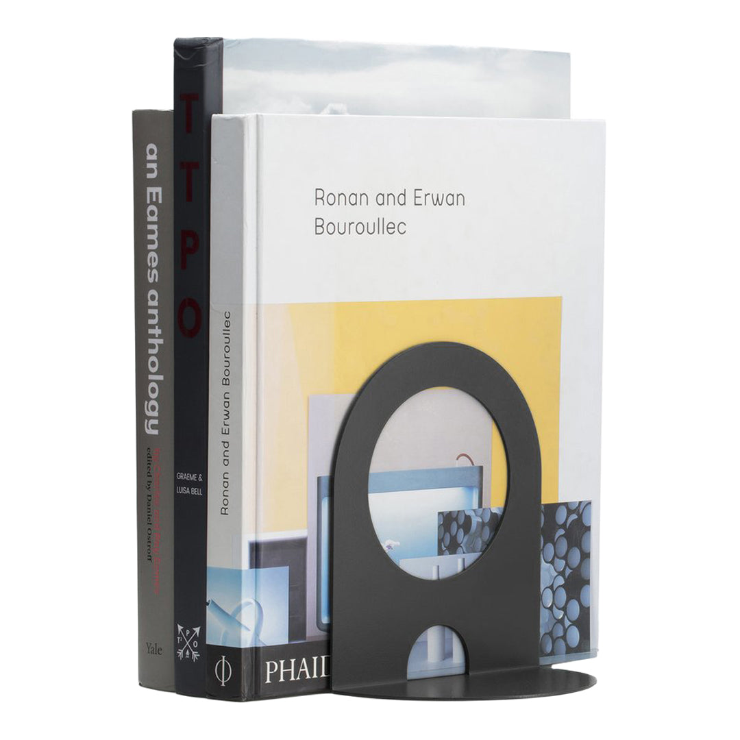 Black bookends with a circular cutout, showcasing books with colorful covers and various graphic patterns.