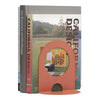 Orange bookend with a modern cutout design, complementing colorful book spines with geometric patterns.