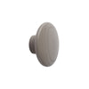Grey wooden knob with a smooth, round shape and subtle wood grain pattern. Perfect for modern home decor.