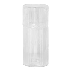 Clear glass container with vertical ribbed texture, ideal for stylish home decor or storage solutions.
