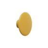 Round yellow knob with a smooth, textured surface, perfect for adding a pop of color to furniture.